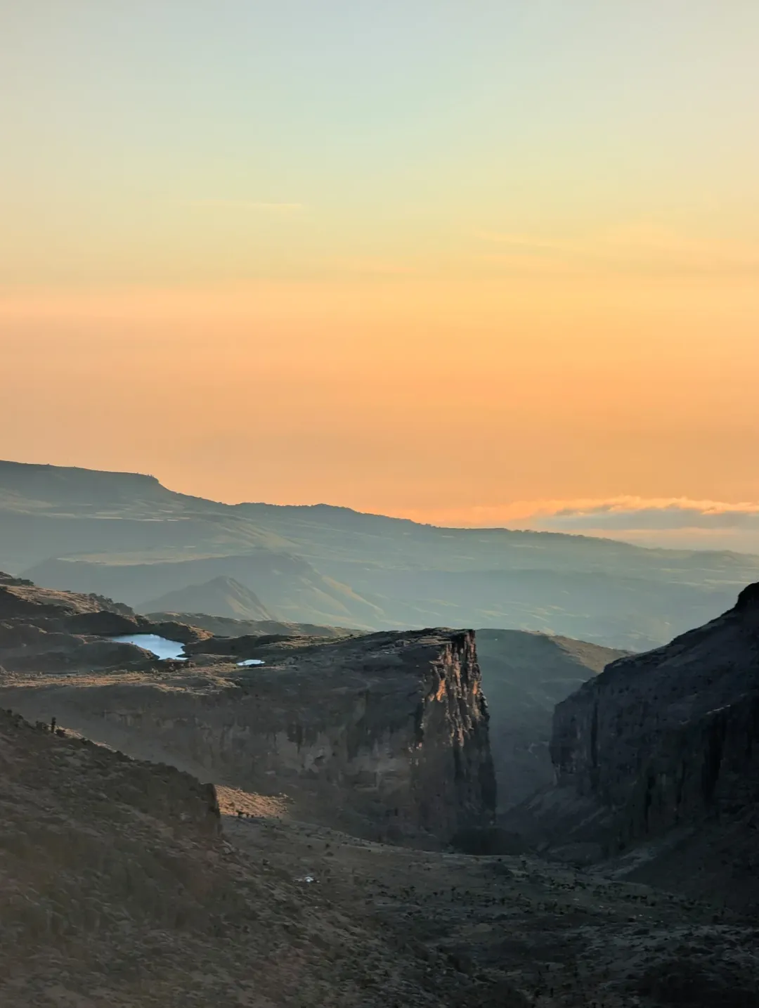 Distant view across the Chogoria Route and Gorges Valley on Mount Kenya at sunrise