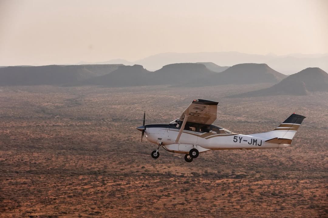 Light aircraft flying over Kenya's rugged southern safari landscape