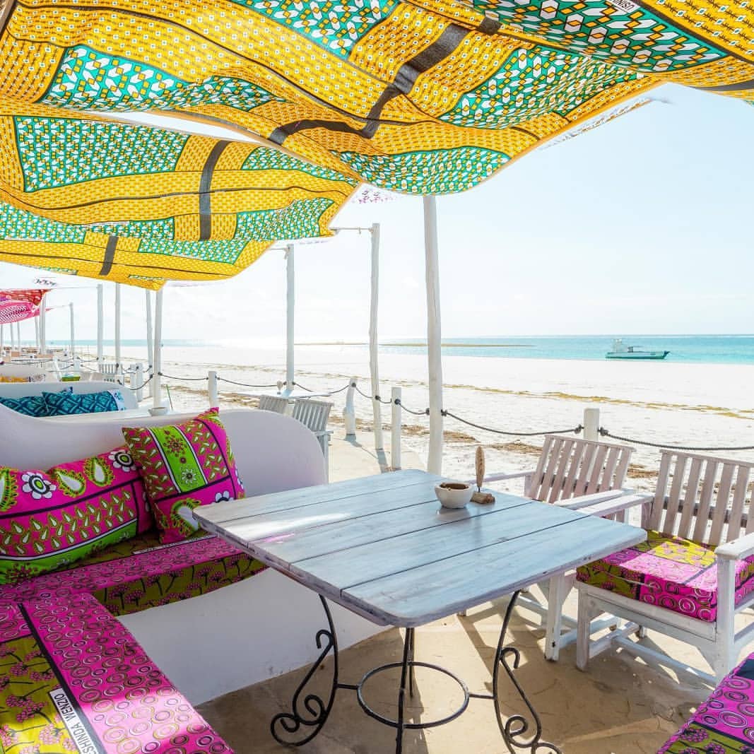 Colourful shaded beach dining terrace beside the Indian Ocean