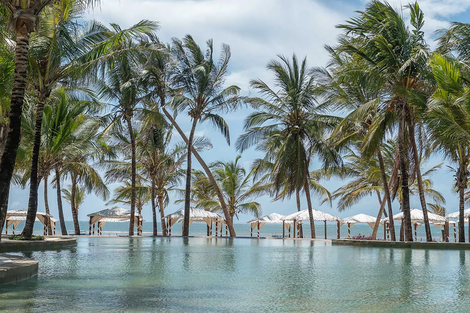 Beachfront pool and private gazebos at Billionaire Resort in Malindi