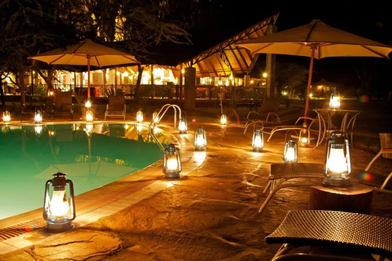 Lantern-lit swimming pool at Ashnil Samburu Camp in Buffalo Springs National Reserve.