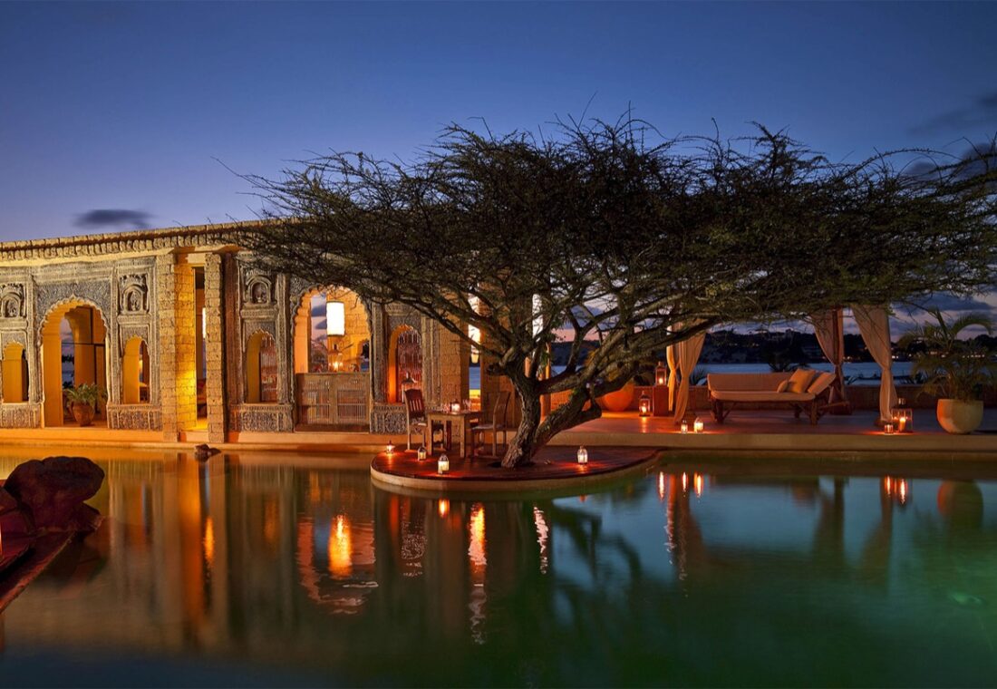 Lantern-lit ocean pool and Swahili architecture at The Majlis Resort