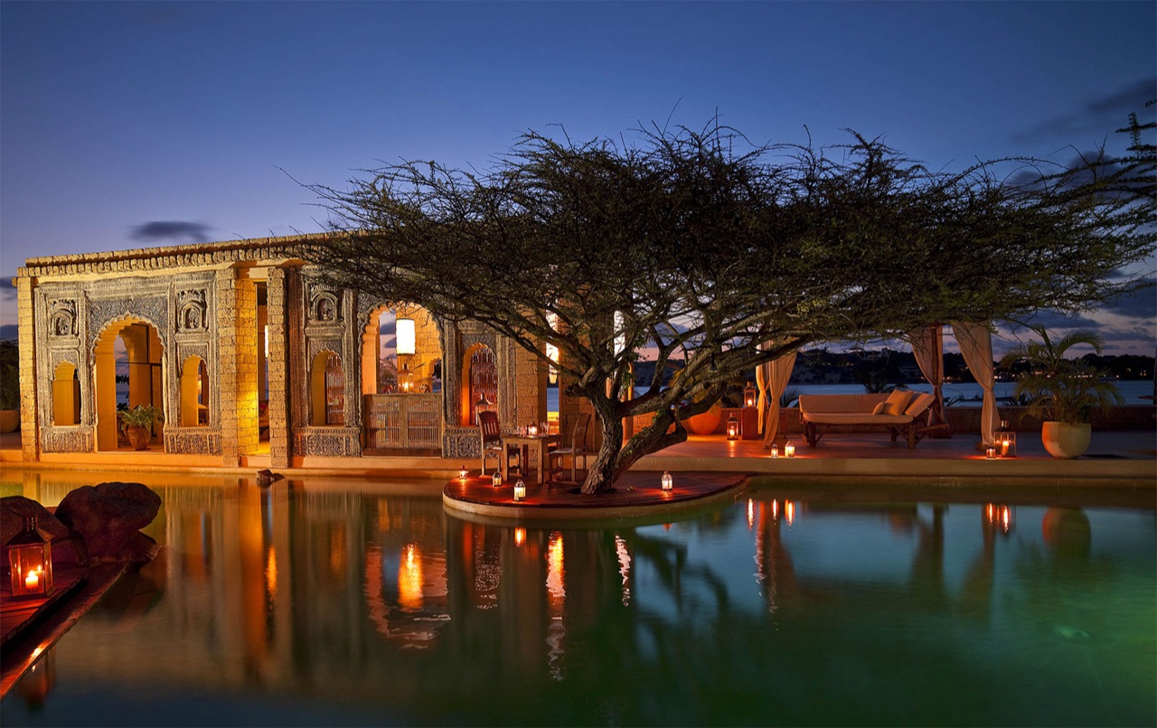 Lantern-lit ocean pool and Swahili architecture at The Majlis Resort