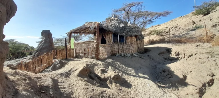 Traditional thatched guest cottage at Eliye Springs Resort on Lake Turkana.