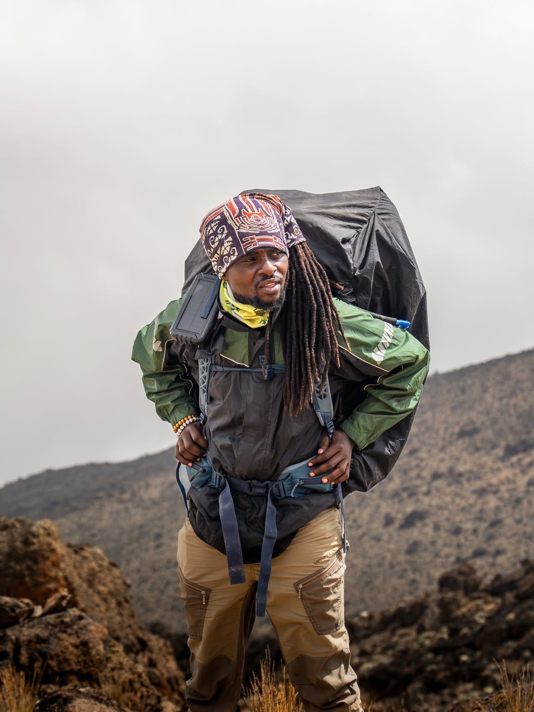 Emanuel Wako carrying an expedition pack on Mount Kilimanjaro