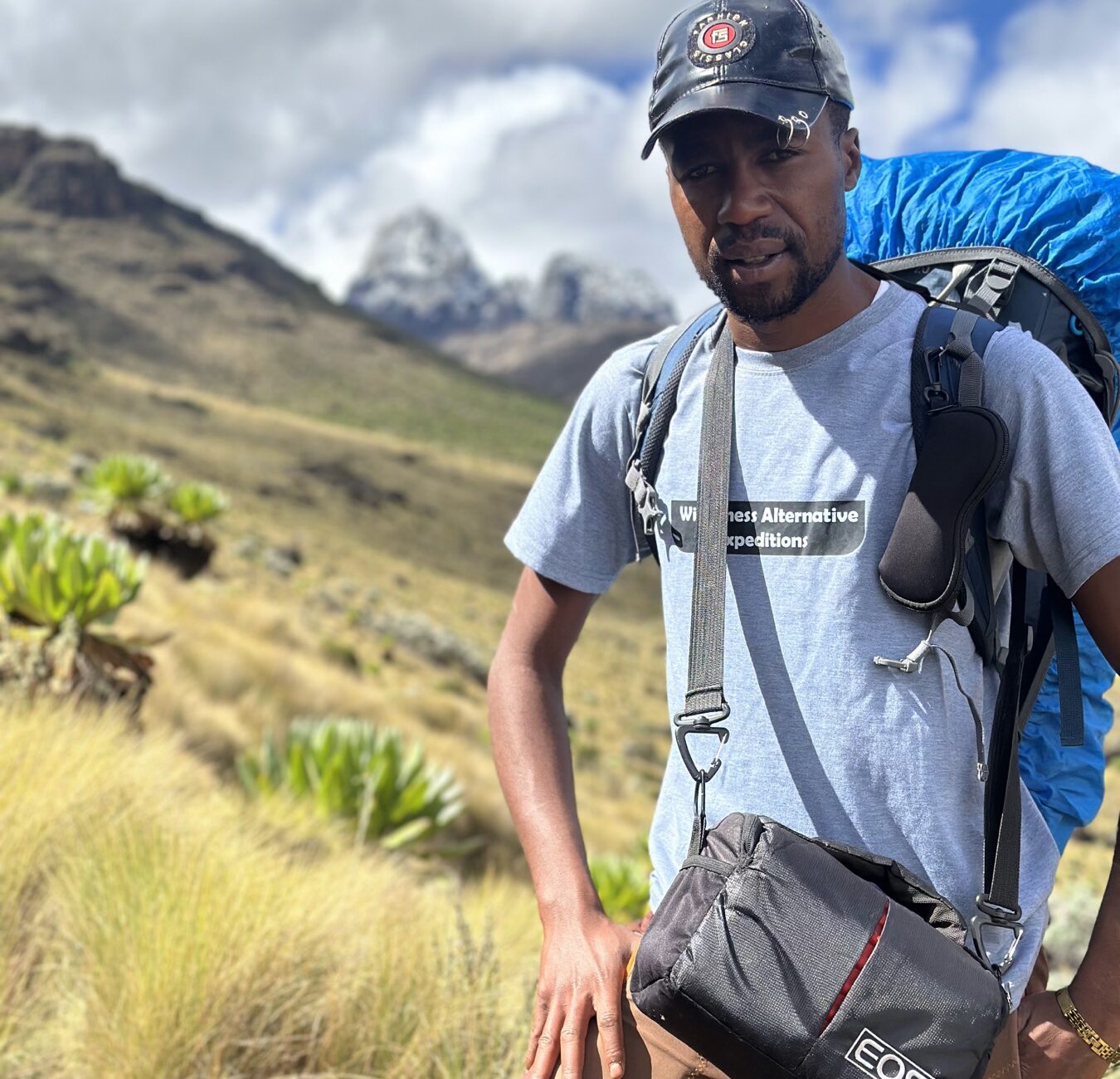 Joseph Kimani, Wilderness Alternative Expedition head guide, carrying an expedition pack on Mount Kenya