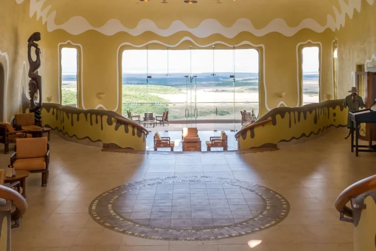 Curved lounge interior at Mara Serena Safari Lodge overlooking the Mara Triangle.
