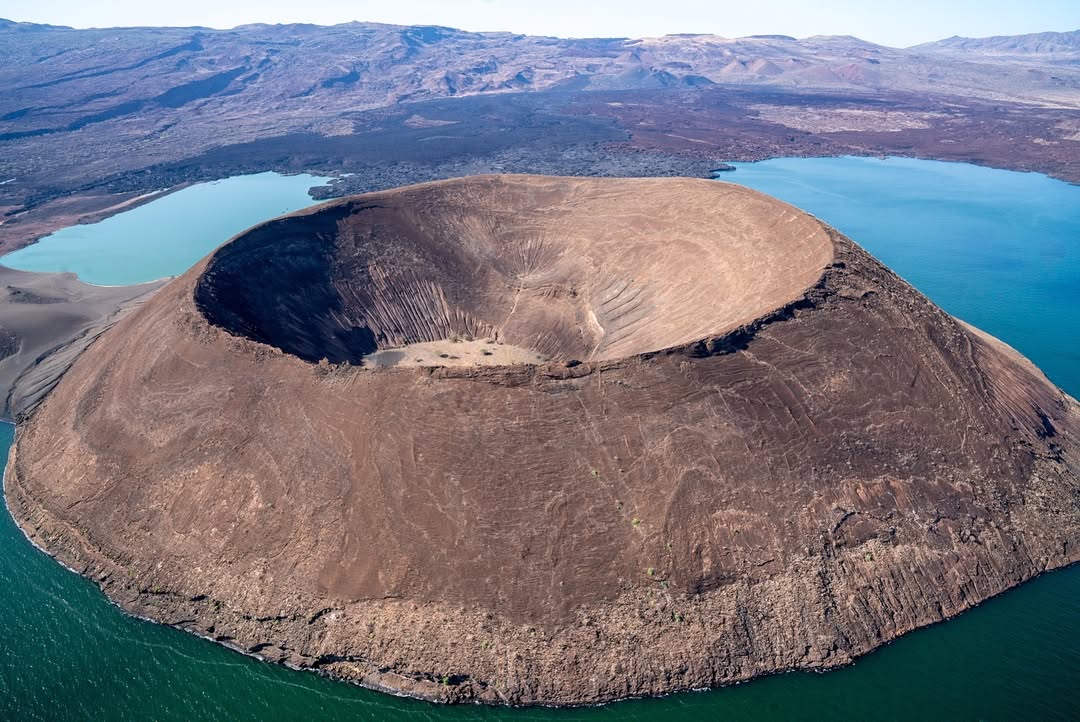Aerial view across Nabiyotum Crater and the blue-green waters of Lake Turkana