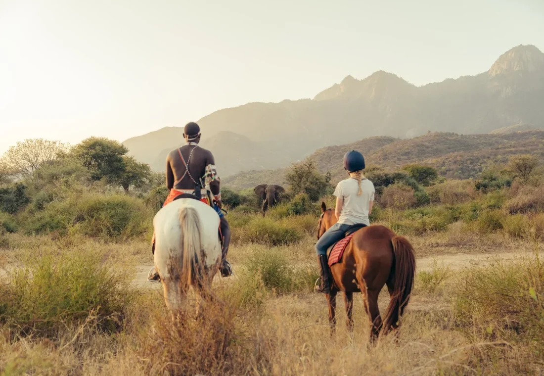 Guest riding through the wilderness near Sarara in Namunyak Conservancy.
