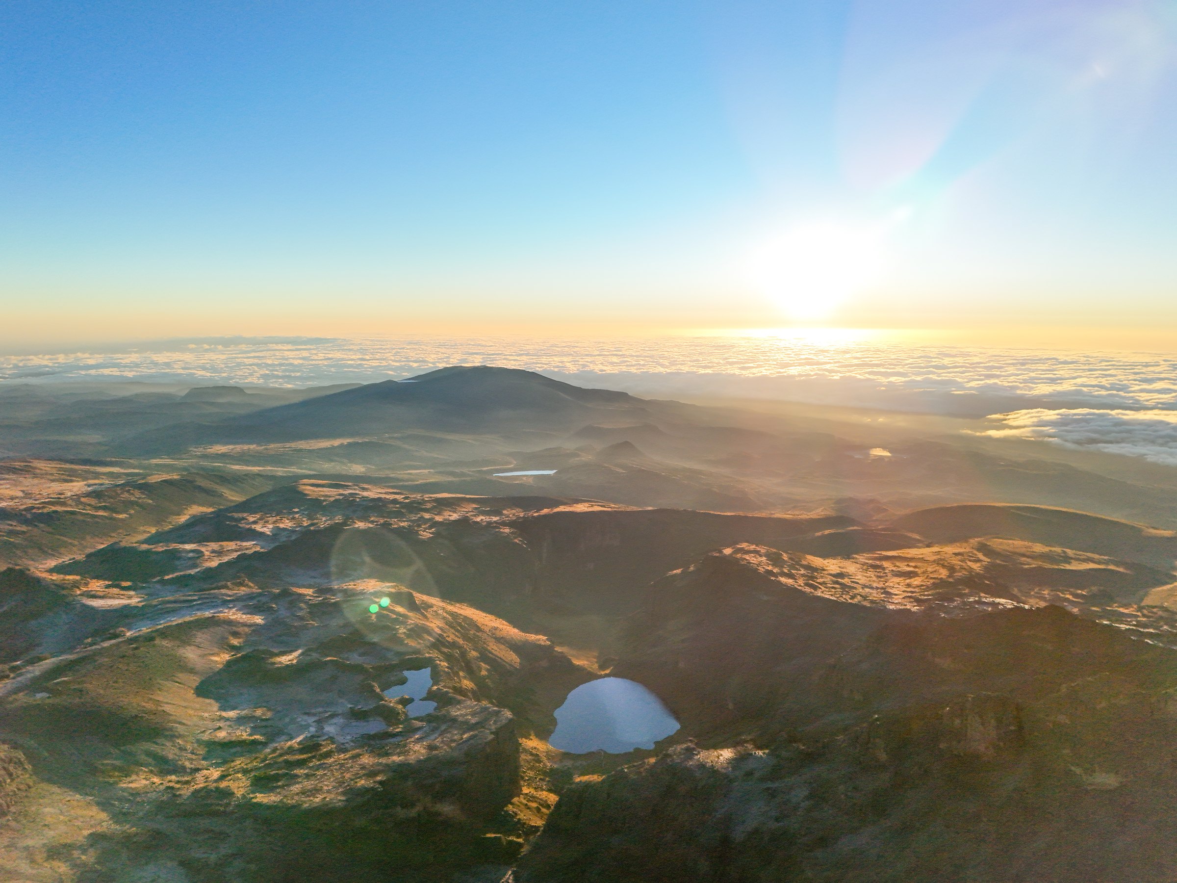 View from Point Lenana across Lake Michaelson, the Mintos tarns and distant Lake Ellis on Mount Kenya’s Chogoria Route